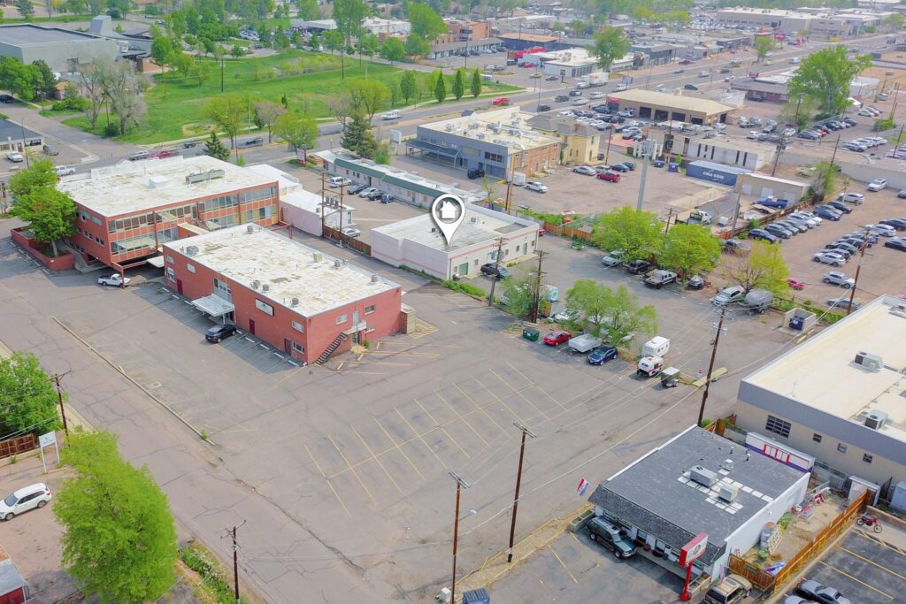 Aerial view of 8700 W Colfax Ave and the West Colfax Avenue corridor in Lakewood, Colorado