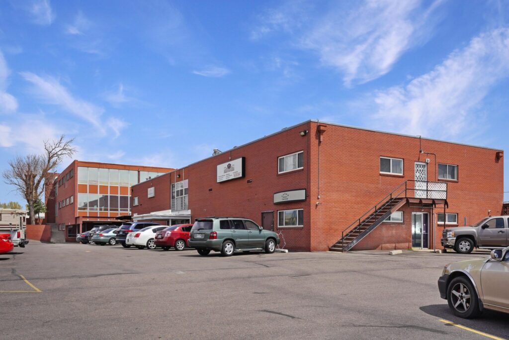 Aerial view of 8790 W Colfax Ave and the West Colfax Avenue corridor in Lakewood, Colorado
