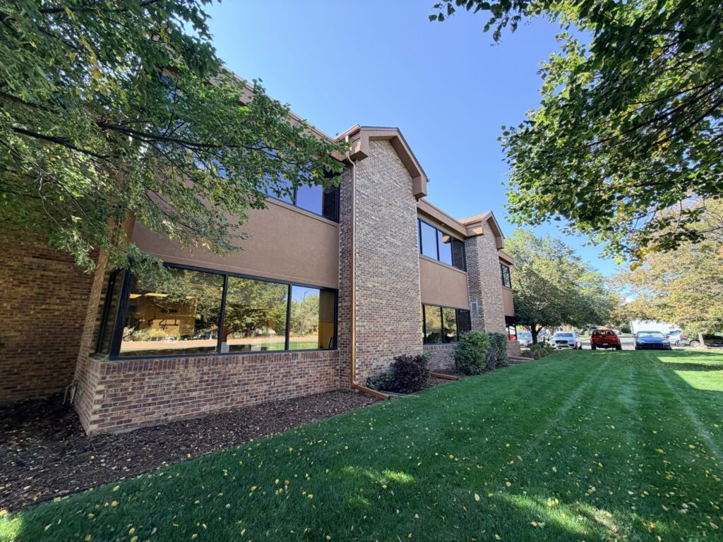 Landscaped lawn along the side of the building