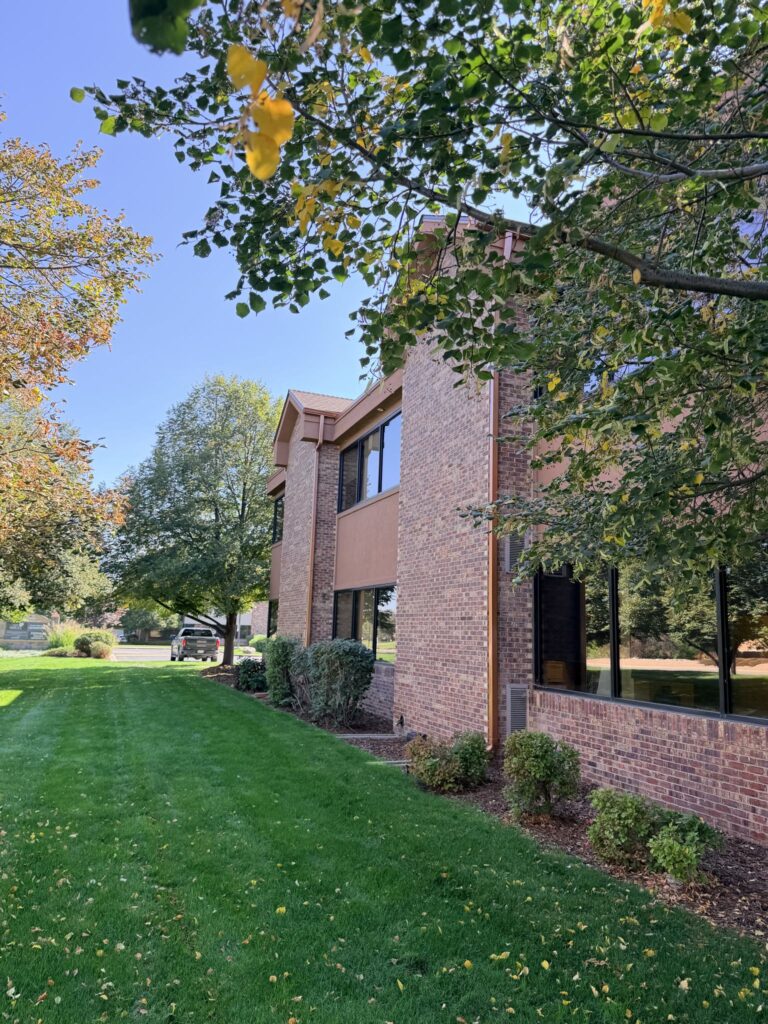 Brick exterior and lawn along the building
